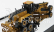 Dm-models Caterpillar Cat24m Ruspa Livellatrice Gommata - škrabací traktor, motorový grejder 1:125 žltá čierna